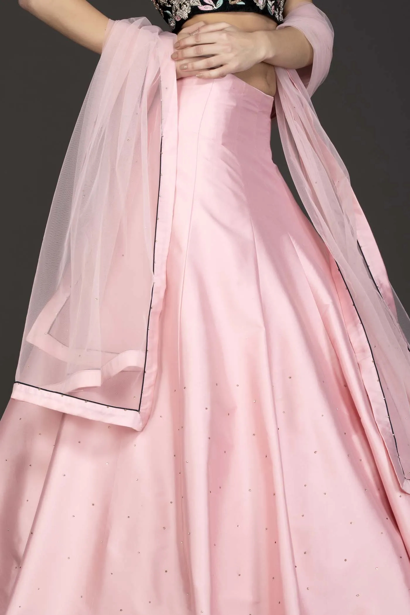 Dark Green Velvet Top With Baby Pink Silk Lehenga And Net Dupatta