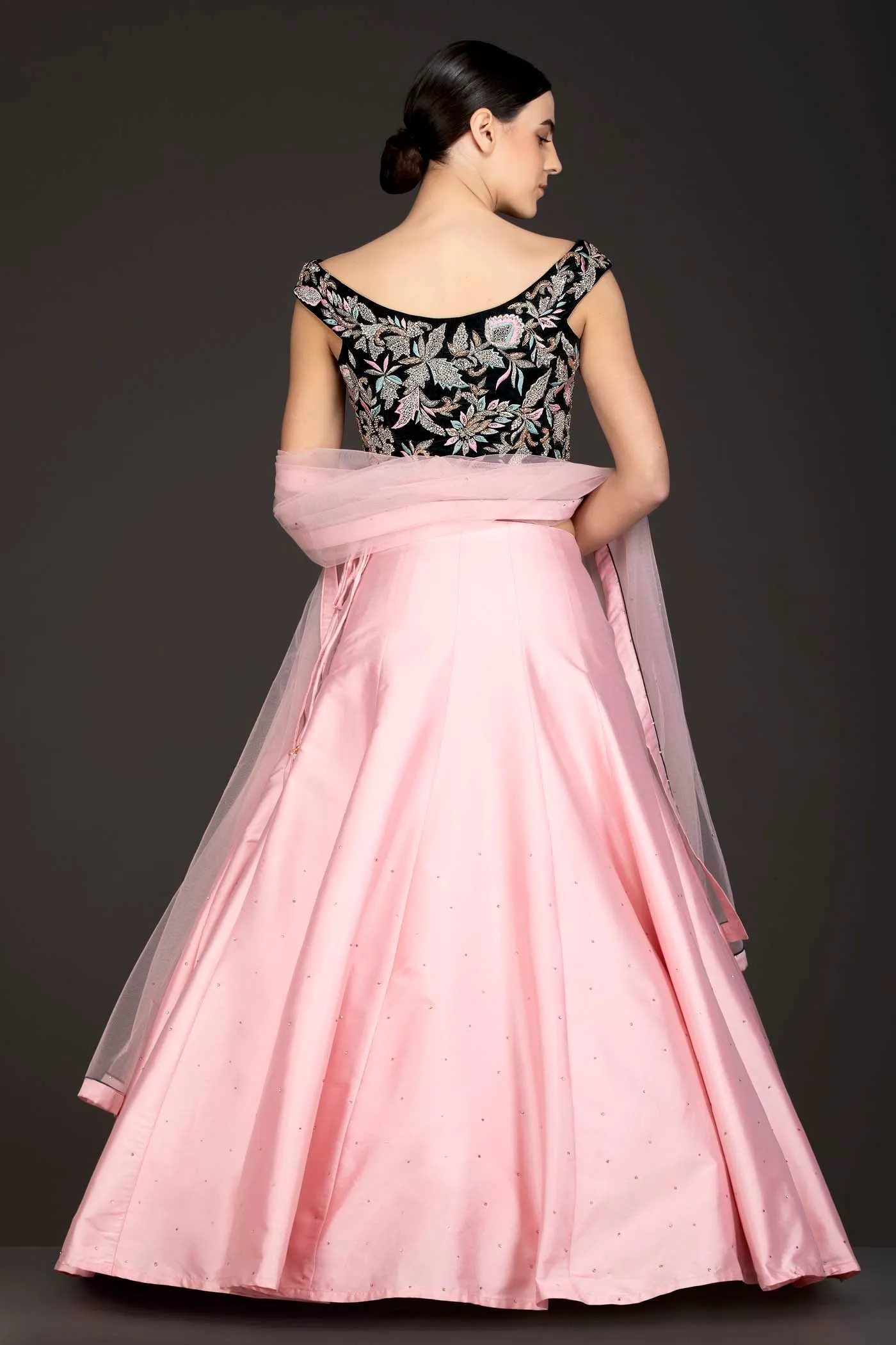 Dark Green Velvet Top With Baby Pink Silk Lehenga And Net Dupatta